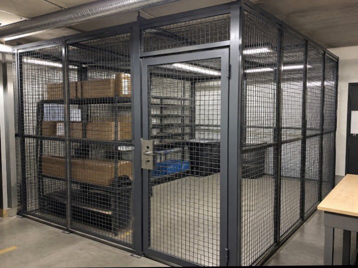 Steel mesh storage security cage inside a building