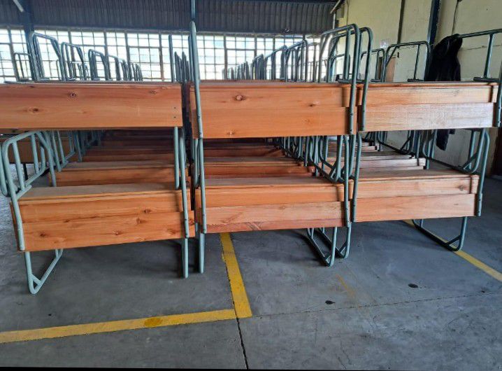 Stacks of completed school desks ready for dispatch